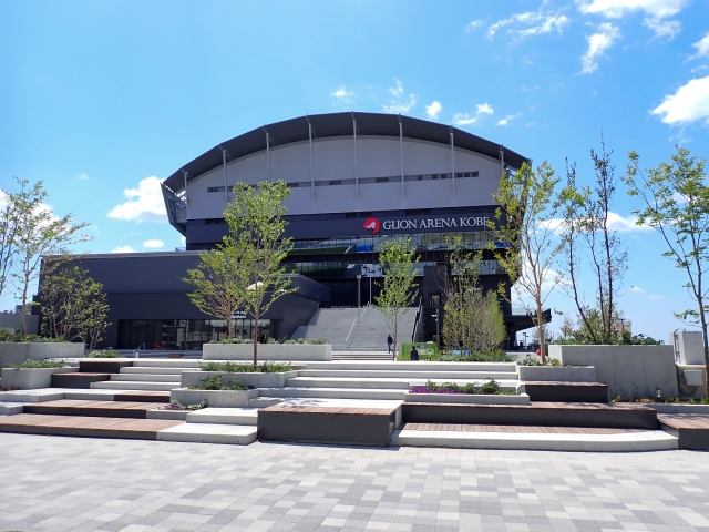 Front approach and steps of GLION ARENA KOBE with landscaped greenery